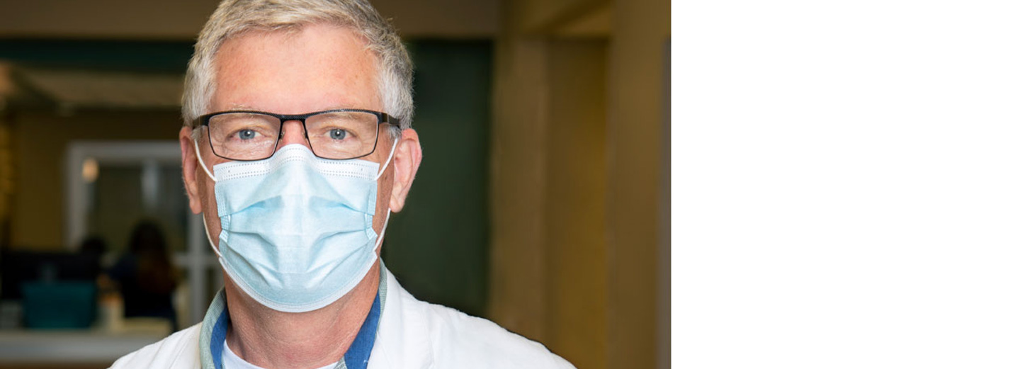 Doctor wearing glasses and surgical mask