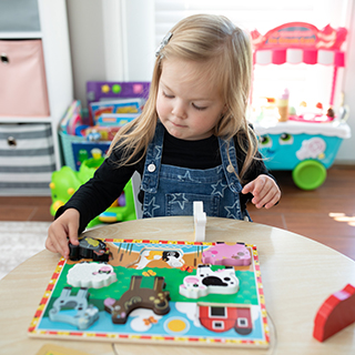 Strong Starts little girl indoor play