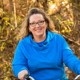 Jennifer, knee replacement patient on bicycle
