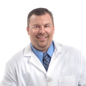 photo: Dr. Green wearing white coat