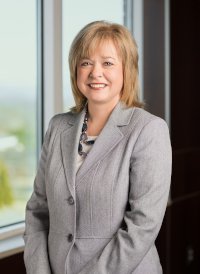 photo: Trish Baise wearing khaki suit