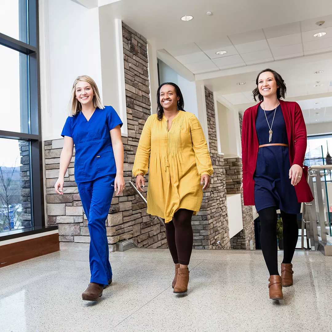 Three Ballad Health employees walking together