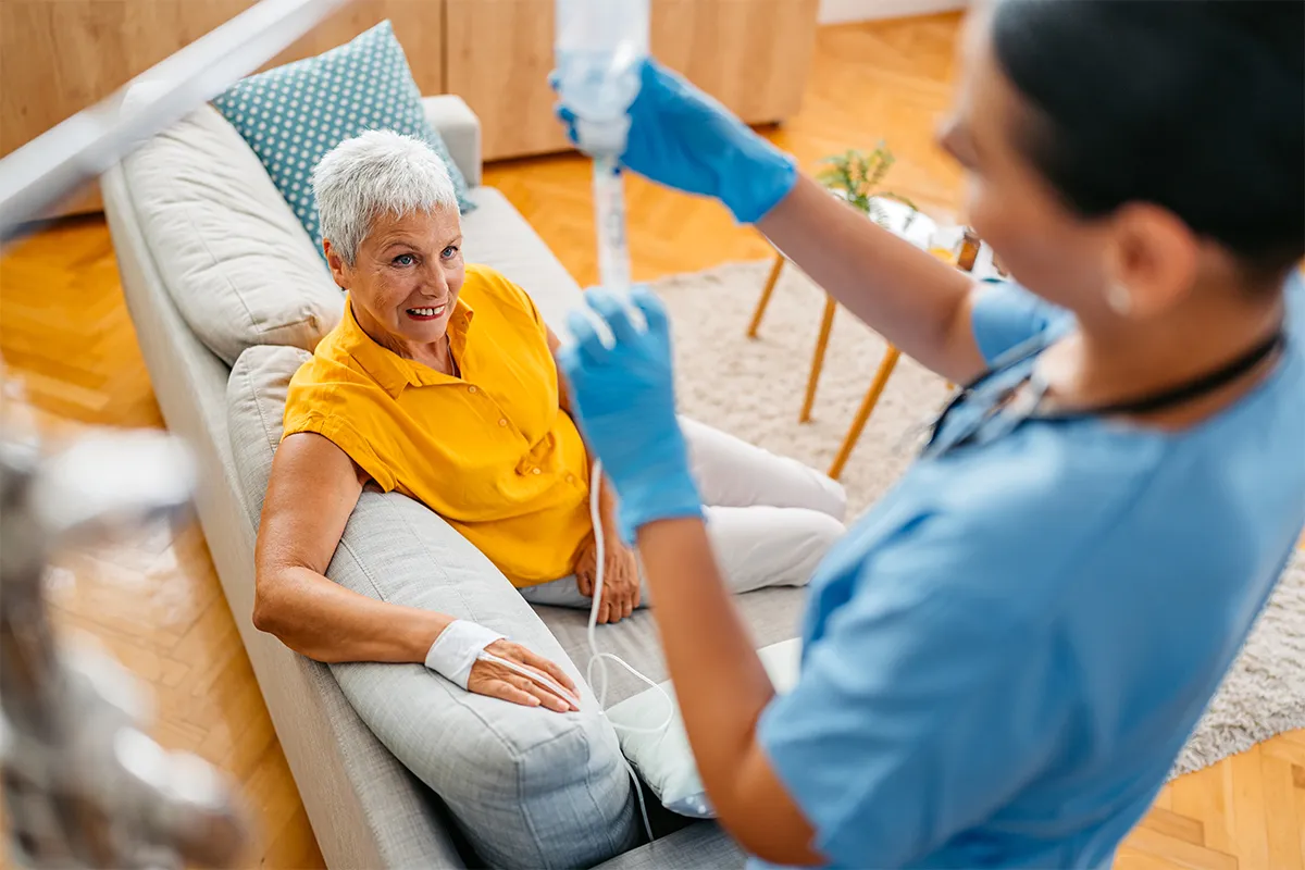 Photo of elderly woman receiving infusion