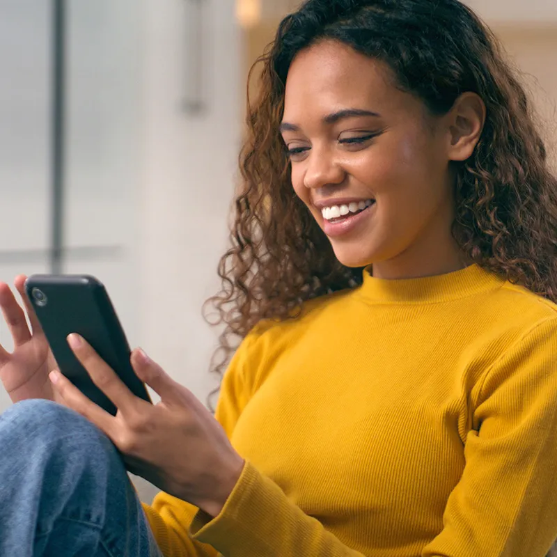 Photo of woman using an app on her mobile device