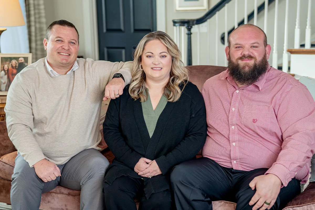 Family portrait of Sara, her husband, and her brother