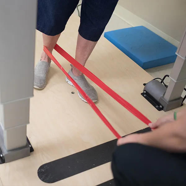 Photo of elderly patient using exercise band