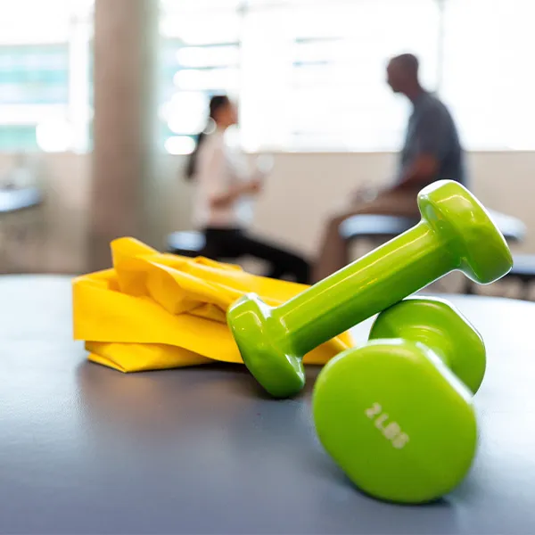 Photo of physical therapy dumbbells and bands