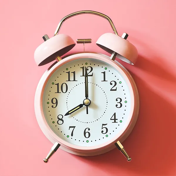 A classic pink alarm clock